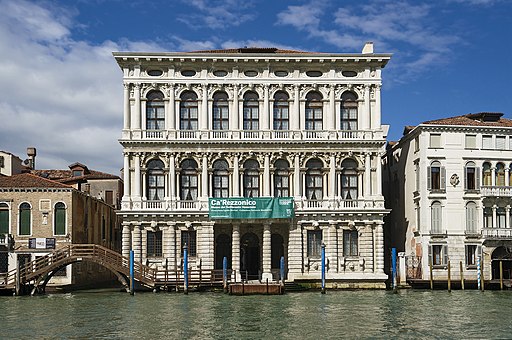 The white marble façade of Ca' Rezzonico on the Grand Canal of Venice, Italy