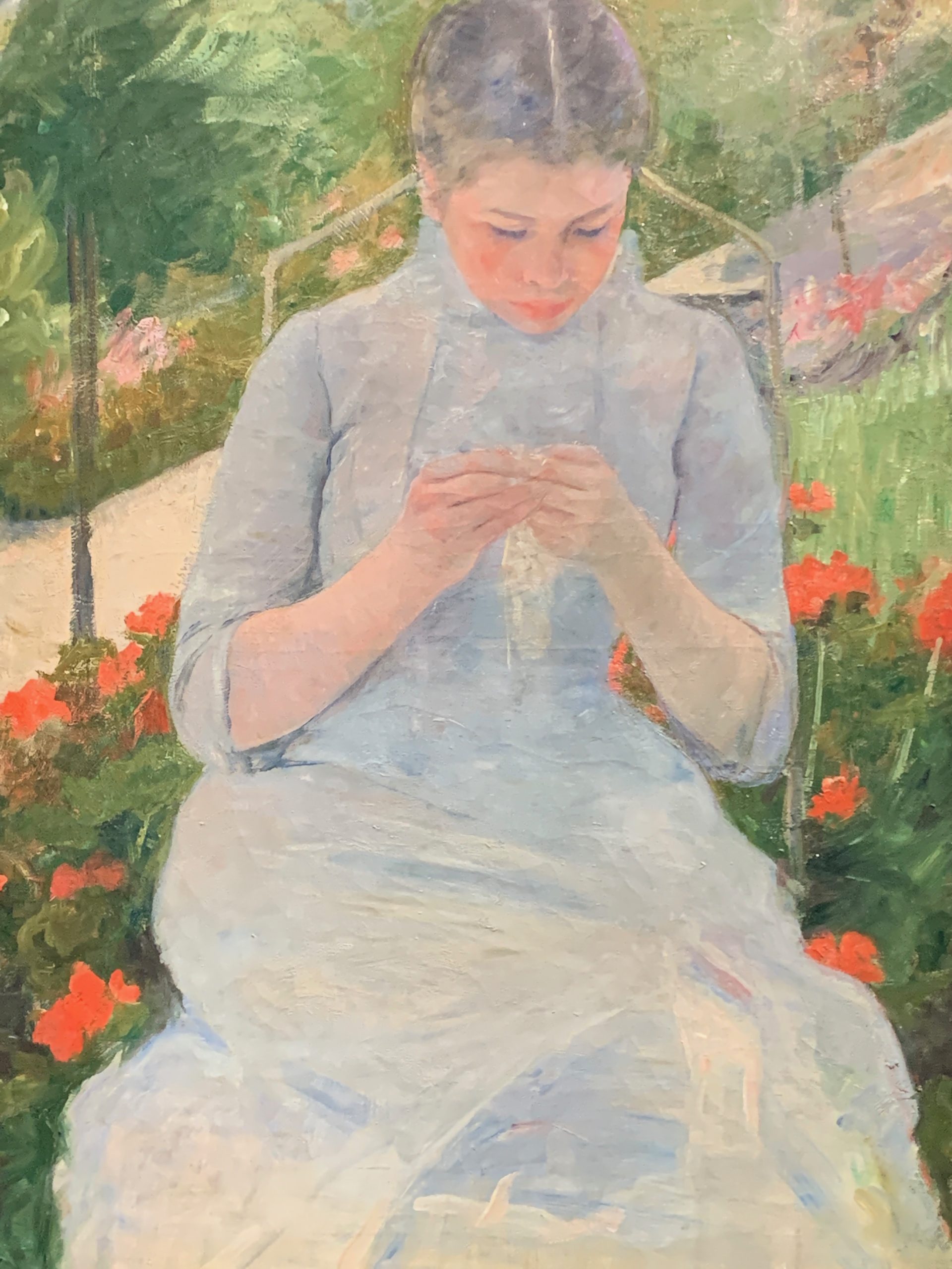 Young Woman Sewing in a Garden<br/>by Mary Cassatt