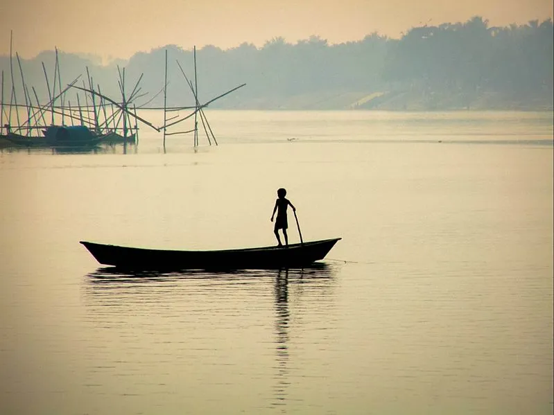 boy on boat ganges river